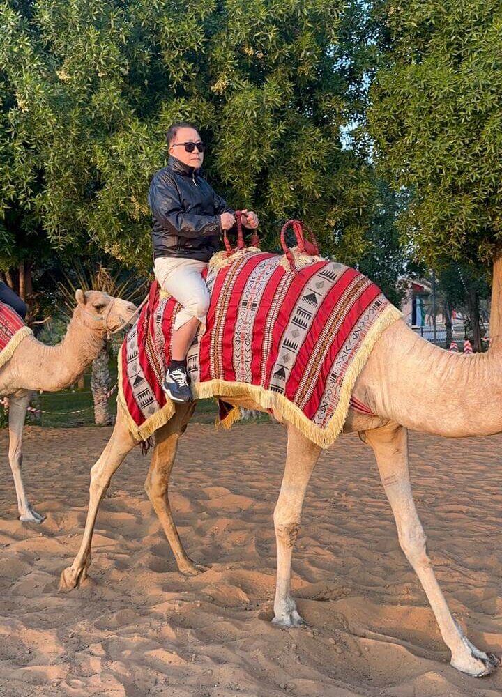 Man riding a camel